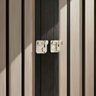 OnePaw ELARA close-up of a wooden door with a metallic handle.