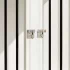 OnePaw ELARA close-up of a white cabinet with black trim and silver hinges.