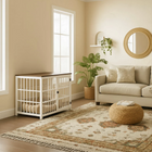 OnePaw Ares living room with a white pet crate, beige sofa, and decorative rug.