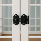 OnePaw Ares  black latch on a white door with glass panels