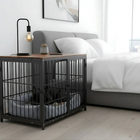 OnePaw Ares pet crate in a bedroom setting with a bed and lamp in the background