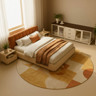 OnePaw ATHENA modern bedroom with a bed, round rug, and pet crate.