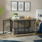 OnePaw AURELIA pet crate integrated into a wooden furniture piece with decorative elements in a room.