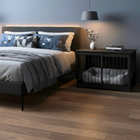OnePaw AURELIA modern bedroom with a bed and a black pet crate on a wooden floor.
