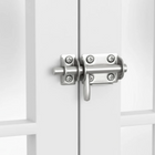 OnePaw AVENOR metal latch on a white metal door.