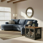 OnePaw AVENOR living room with a gray sectional sofa, round mirror, and wooden pet crate.