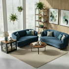 OnePaw AVENOR modern living room with blue sofas, a wooden coffee table, and pet crate.