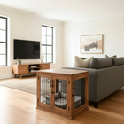 OnePaw CALLISTO wooden pet crate in a living room with a couch and TV.