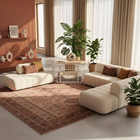 OnePaw EIRENE modern living room with beige sectional sofa, coffee table, and a white pet crate.