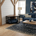 OnePaw EIRENE living room with a dog crate, sofa, and coffee table.