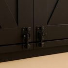 OnePaw EMBER close-up of black cabinet doors with metal hinges on a beige surface.