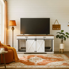 OnePaw EMBER living room with a TV on a white wooden pet crate, lamp, and plant.