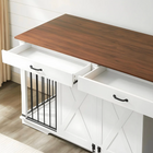 OnePaw EMBER wooden desk with a white cabinet underneath featuring a pet crate.