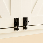 OnePaw EMBER close-up of black cabinet hinges on a white cabinet door