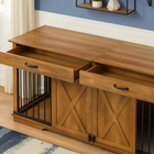 OnePaw EMBER wooden pet crate with storage drawers in a room with blue walls and white baseboards.
