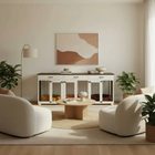 Modern living room with white furniture, pet crate, and a wall art piece.
