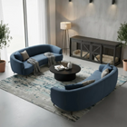 OnePaw HAVEN modern living room with blue curved sofas, a coffee table, and a pet crate.
