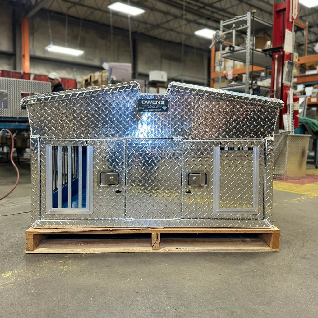 Owens 55014 Hunter Series Big T Double Compartment Dog Box with Dual Lid Top Storage in a warehouse setting