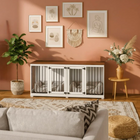 OnePaw LIVIA living room with a white pet crate, sofa, rug, and decorative elements.