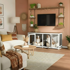 OnePaw LIVIA living room with a TV above pet crates, surrounded by decor elements.