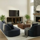 OnePaw LIVIA modern living room with dark blue sofa, wooden coffee table, and a pet crate.