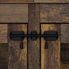 OnePaw LIVIA black metal door handle on a wooden pet crate door.