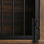 Close-up of a wooden crate with metal hinges and handles.