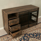 Wooden furniture piece with pet crate on a patterned rug