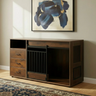 Wooden dog crate with open cabinet and drawers in a room with abstract art on the wall.