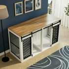Wooden pet crate with metal doors in a room with blue walls and a lamp.
