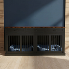 Dark wooden pet crate with metal bars on a wooden floor and blue wall background