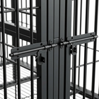 Close-up of a metal gate latch on a cage