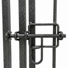 Close-up of a metal gate with a lock on a white background