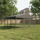 Large outdoor dog kennel with a roof in a backyard setting