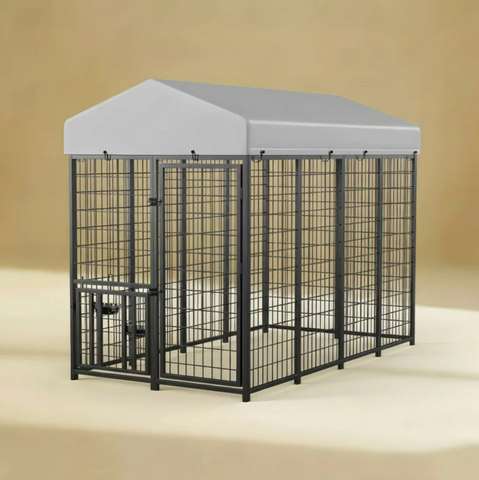 Large black metal dog crate with a gray cover on a beige background