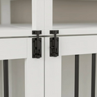 Close-up of black cabinet hinges on a white cabinet with a neutral background