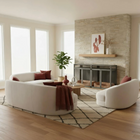 Modern living room with pet crate, white sectional sofa, fireplace, and decorative elements.