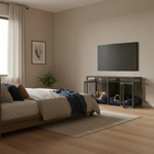 Modern bedroom with a bed, pet crate, television, and decorative elements.