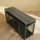 Wooden pet crate with a wooden top on a wooden floor