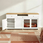 White cabinet with wooden top and pet crate in a room with a patterned rug