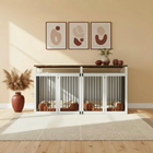 Modern interior with a pet crate, abstract art, and decorative items.