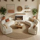 OnePaw SELENE modern living room with white curved sofa, round coffee table, and a wooden pet crate.