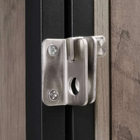 OnePaw SELENE metal latch on a wooden pet crate door.