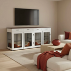 Living room with a large white dog kennels, a TV above it, and a couch with red accents.