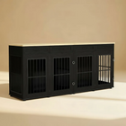 Black pet crate with metal panels on a beige background