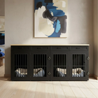 Black pet crate with beds inside, placed against a wall with abstract art.