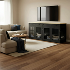 Living room with a black pet crate unit against a wall, featuring a TV above it.