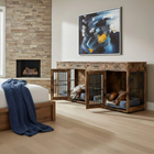 Wooden pet crates in a living room with abstract art on the wall.