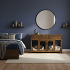 OnePaw THEIA wooden sideboard with pet kennels in a bedroom setting with blue walls and wooden floor.
