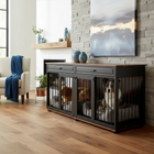 OnePaw Vesta dog crate integrated into a piece of furniture in a living room setting.